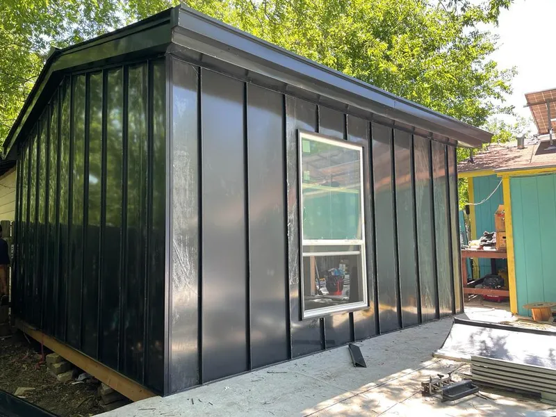 Black standing seam metal wall panels for Roof Inspection in Pea Ridge