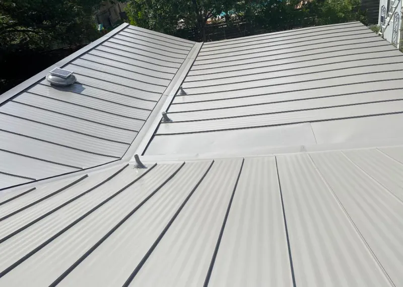 Solar attic fan installed on a metal roof for Roof Ventilation in Pea Ridge